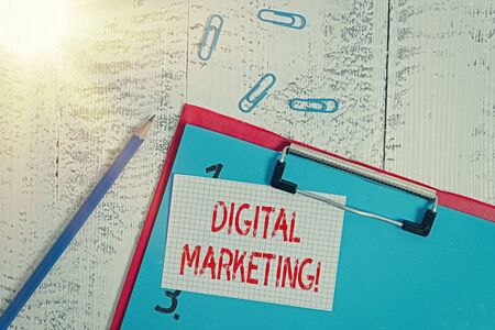 Word writing text Digital Marketing. Business photo showcasing market products or services using technologies on Internet Clipboard blank paper sheet pencil note clips old retro wooden backgroundの写真素材
