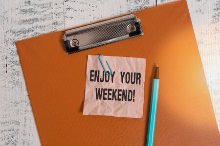 Conceptual hand writing showing Enjoy Your Weekend. Concept meaning wishing someone that something...