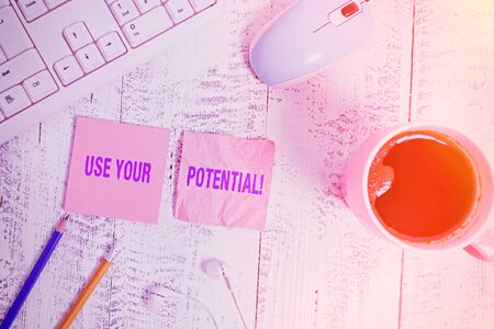 Handwriting text Use Your Potential. Conceptual photo achieve as much natural ability makes possible technological devices colored reminder paper office supplies keyboard mouseの写真素材