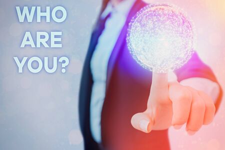 Writing note showing Who Are You question. Business concept for someone asking your demonstration background or historyの写真素材