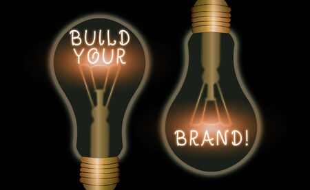 Writing note showing Build Your Brand. Business concept for creates or improves customers knowledge and opinions of productの写真素材