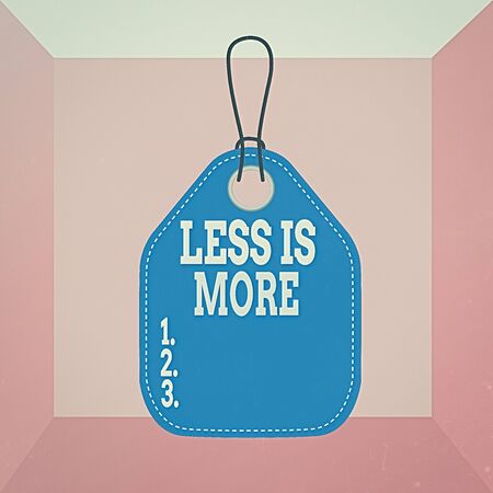 Conceptual hand writing showing Less Is More. Concept meaning used to express a minimalist approach is more effective. Empty tag colorful background label rectangle attach stringの写真素材