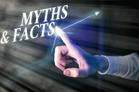 Handwriting text writing Myths And Facts. Conceptual photo usually traditional story of ostensibly historical eventsの写真素材
