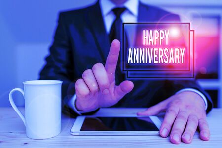 Text sign showing Happy Anniversary. Business photo text The annually recurring date of a past event celebration Male human wear formal clothes present presentation use hi tech smartphoneの写真素材