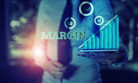 Writing note showing Margin. Business concept for amount by which revenue from sales exceeds costs in a businessの写真素材