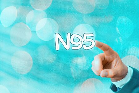 Writing note showing N95. Business concept for personal protective equipment that are used to protect the wearerの写真素材