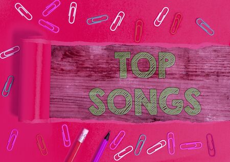 Text sign showing Top Songs. Business photo text recorded song that becomes broadly popular or wellknownの写真素材
