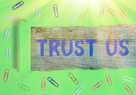 Word writing text Trust Us. Business photo showcasing to believe that someone is good and honest and will not harmの写真素材