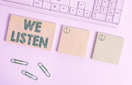 Handwriting text writing We Listen. Conceptual photo Group of showing that is willing to hear anything you want to say Flat lay above blank copy space sticky notes with business conceptの写真素材