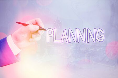 Conceptual hand writing showing Planning. Concept meaning process of thinking about the activities required to achieve a goalの写真素材