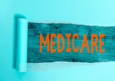 Conceptual hand writing showing Medicare. Concept meaning the federal government plan in US for paying certain hospitalの写真素材