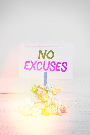 Text sign showing No Excuses. Business photo text should not happen or expressing disapproval that it has happened Reminder pile colored crumpled paper clothespin reminder white wooden spaceの写真素材