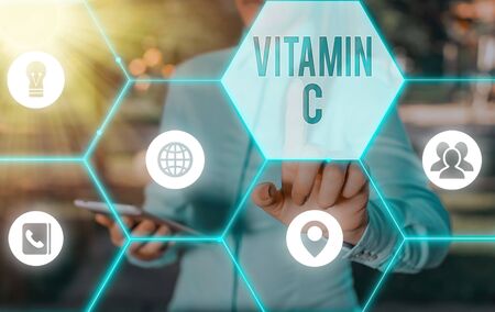 Writing note showing Vitamin C. Business concept for it promotes healing and helps the body absorb...