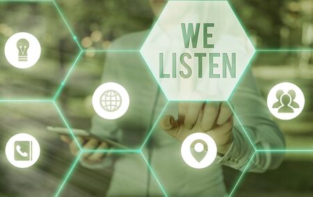 Writing note showing We Listen. Business concept for Group of showing that is willing to hear...