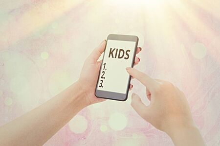 Writing note showing Kids. Business concept for a young being below the age of puberty or below the legal ageの写真素材