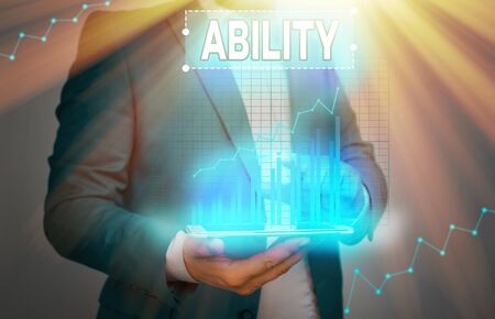 Conceptual hand writing showing Ability. Concept meaning the physical or mental power or skill needed to do somethingの写真素材