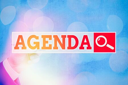 Conceptual hand writing showing Agenda. Concept meaning list items that participants hope to accomplish at meetingsの写真素材