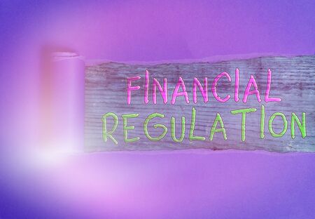 Conceptual hand writing showing Financial Regulation. Concept meaning aim to Maintain the integrity of Finance Systemの写真素材