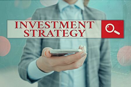 Conceptual hand writing showing Investment Strategy. Concept meaning Set of Rules Procedures Behavior a Guide to an Investorの写真素材