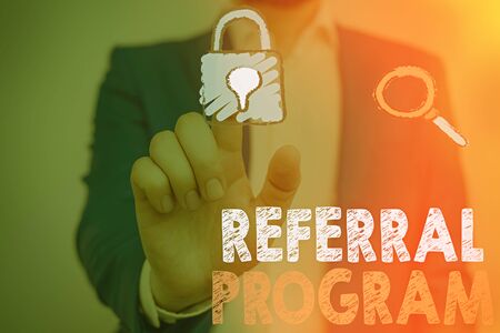 Conceptual hand writing showing Referral Program. Concept meaning sending own patient to another physician for treatmentの写真素材