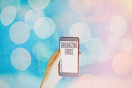 Handwriting text Organizing Force. Conceptual photo being United powerful group to do certain actionsの写真素材