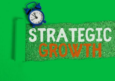 Writing note showing Strategic Growth. Business concept for create plan or schedule to increase stocks or improvementの写真素材