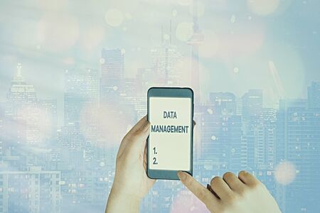 Handwriting text writing Data Management. Conceptual photo The practice of organizing and maintaining data processesの写真素材