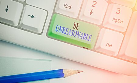 Conceptual hand writing showing Be Unreasonable. Concept meaning Behaving not in accordance with practical realitiesの写真素材