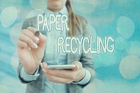 Text sign showing Paper Recycling. Business photo text Using the waste papers in a new way by recycling themの写真素材