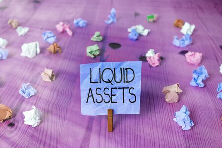 Handwriting text writing Liquid Assets. Conceptual photo Cash and Bank Balances Market Liquidity Deferred Stockの写真素材