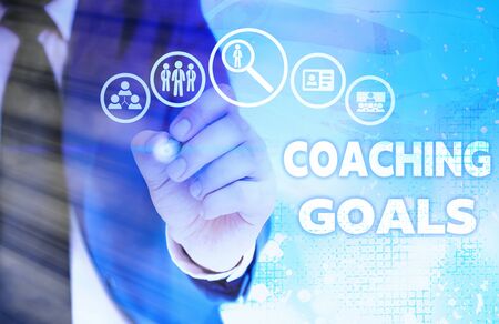 Writing note showing Coaching Goals. Business concept for Empowers individuals Encourages them to take responsibilityの写真素材