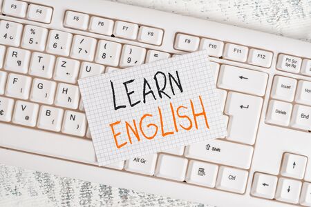Writing note showing Learn English. Business concept for Universal Language Easy Communication and Understand Keyboard office supplies rectangle shape paper reminder woodの写真素材