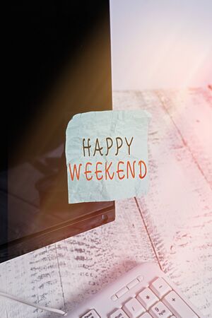 Text sign showing Happy Weekend. Business photo text Cheerful rest day Time of no office work Spending holidays Notation paper taped to black computer monitor screen near white keyboardの写真素材