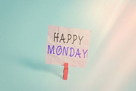 Writing note showing Happy Monday. Business concept for telling that an individual order to wish him great new week Colored clothespin rectangle square shaped paper light blue backgroundの写真素材
