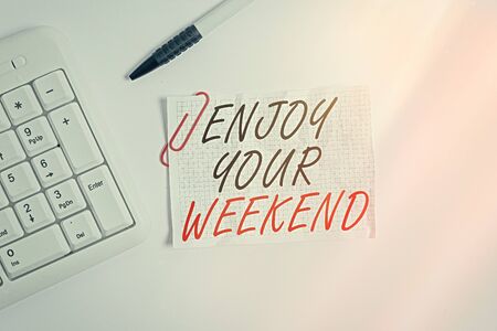 Word writing text Enjoy Your Weekend. Business photo showcasing wishing someone that something nice will happen at holiday White pc keyboard with empty note paper above white backgroundの写真素材