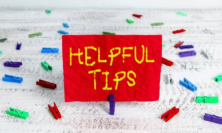 Writing note showing Helpful Tips. Business concept for advices given to be helpful knowledge in lifeの写真素材