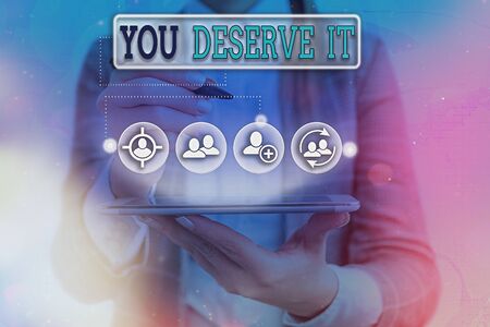 Conceptual hand writing showing You Deserve It. Concept meaning should have it because of their qualities or actionsの写真素材