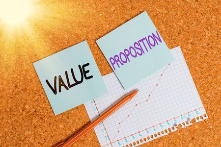 Text sign showing Value Proposition. Business photo text innovation service intended make product attractive Desk notebook paper office cardboard paperboard study supplies table chartの写真素材