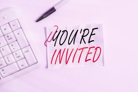 Word writing text You Re Invited. Business photo showcasing make a polite friendly request to someone go somewhere White pc keyboard with empty note paper above white backgroundの写真素材