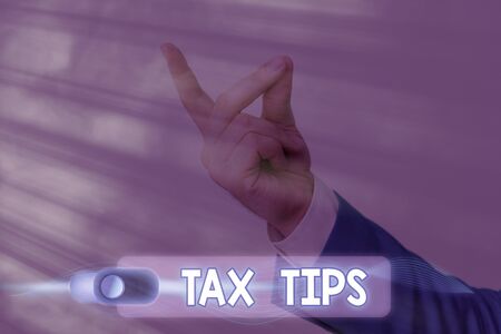 Text sign showing Tax Tips. Business photo text compulsory contribution to state revenue levied by governmentの写真素材
