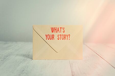 Handwriting text writing Whats Your Storyquestion. Conceptual photo manner of asking an individual about past life events Closed standing rectangular colored envelope old wooden vintage backgroundの写真素材