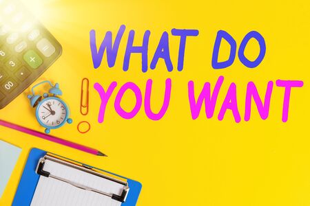 Text sign showing What Do You Want. Business photo showcasing used for offering something to someone or asking their need Clock clips crushed note calculator pencil clipboard band color backgroundの写真素材