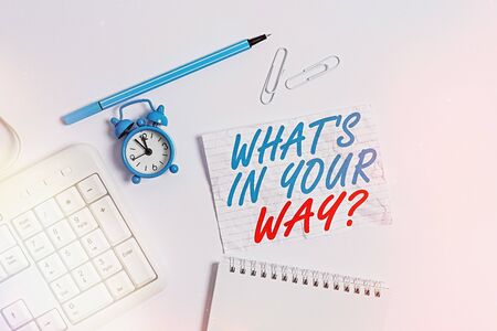 Word writing text What S Is In Your Way question. Business photo showcasing someone needs for a particular action Copy space on empty note paper with clock and pencil on the tableの写真素材