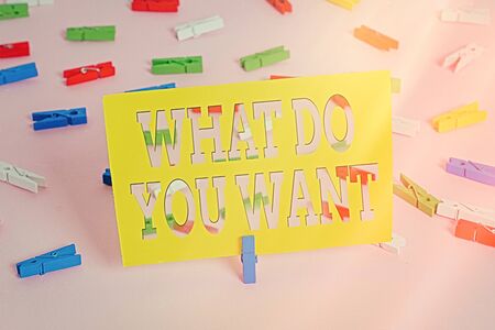 Text sign showing What Do You Want. Business photo text used for offering something to someone or asking their need Colored clothespin papers empty reminder pink floor background office pinの写真素材