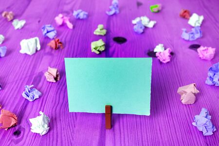 Colored Crumpled Rectangle Shaped Reminder Paper Light Blue Backgroundの写真素材