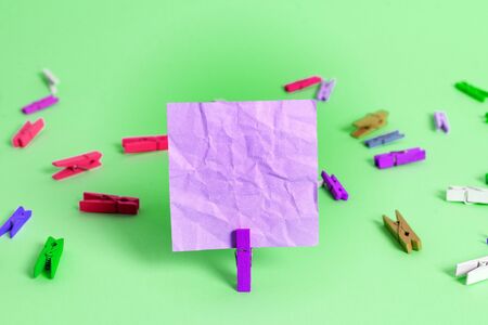 Colored Crumpled Rectangle Shaped Reminder Paper Light Blue Backgroundの写真素材