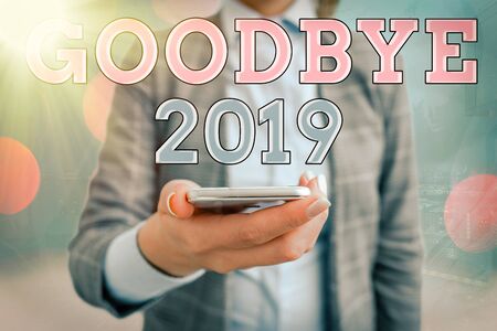 Conceptual hand writing showing Goodbye 2019. Concept meaning welcoming and celebrating a happy new year and hello 2020の写真素材
