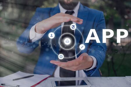 Writing note showing App. Business concept for computer or software application designed to run on a mobile deviceの写真素材