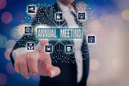 Writing note showing Annual Meeting. Business concept for scheduled annually for the discussion of the business futureの写真素材