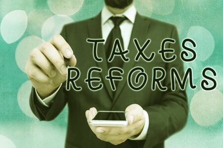 Handwriting text Taxes Reforms. Conceptual photo managing collected taxes in a more efficient processの写真素材